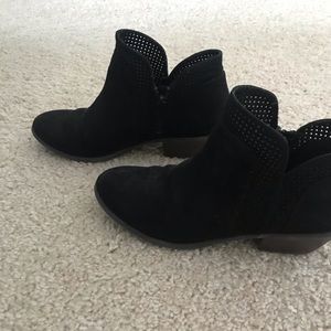 Black booties with perforation detailing